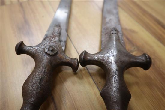 Two 19th century Indian talwar swords, one with scabbard, total length 83 and 88cm